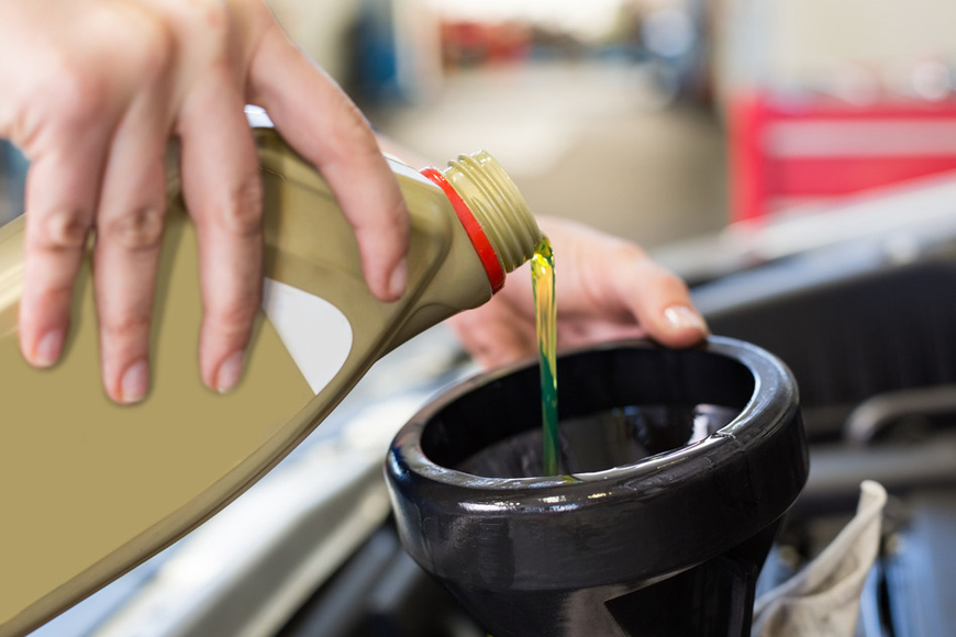 Engine oil being added during a vehicle service